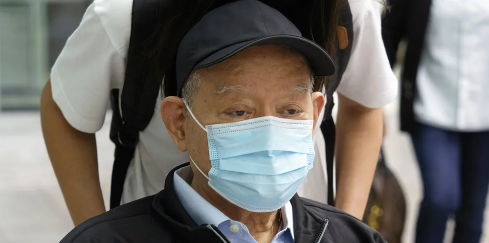 Hin Leong founder Lim Oon Kuin leaves court after being sentenced to 17-and-a-half years in jail, subject to the outcome of an appeal.