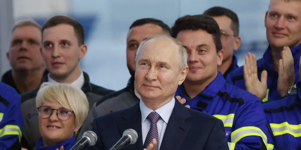 Russian President Vladimir Putin launches the first natural gas liquefaction line on a gravity-type base for the Arctic LNG-2 project as he visits Novatek-Murmansk’s Offshore Superfacility Construction Center in the village of Belokamenka in the Murmansk region on 20 July 2023.
