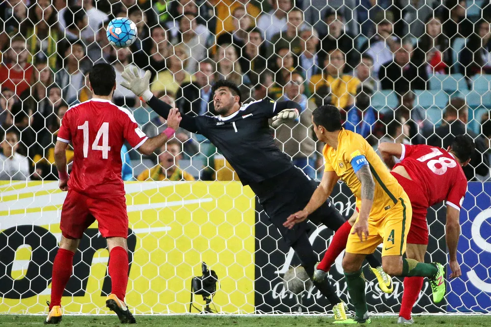 In the net: Australia's Tim Cahill scores against Syria Photo: AP/Rick Rycroft