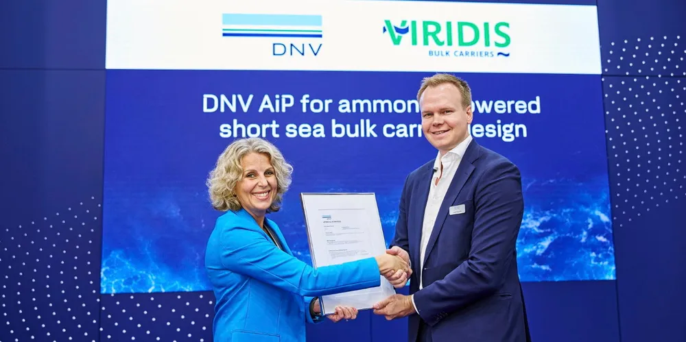 Tuva Flagstad-Andersen, DNV’s manager of northern Europe, presents an approval in principle (AiP) for Viridis Bulk Carriers’ ammonia-fuelled shortsea bulker design to Viridis board member Andre Risholm on Thursday at Nor-Shipping.
