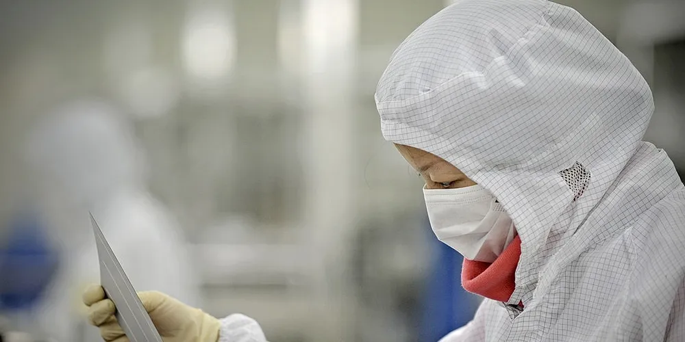 A Trina Solar worker in Changzhou Credit: AFP/Getty