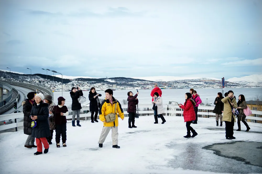 Det statlige bidraget til markedsføring av Norge som reisemål, som nordlysturismen i Tromsø (bildet), blir likevel ikke halvert.
