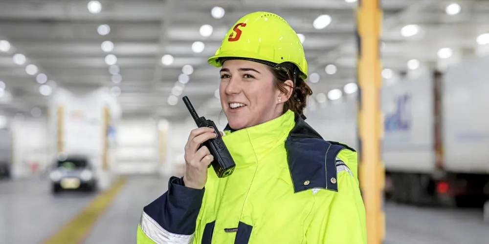 Lynette Bryson, a chief officer with Stena Line, sends instructions to her crew while standing on the vehicle deck of the 1,500-berth Stena Adventurer (built 2002) in Holyhead, Wales.