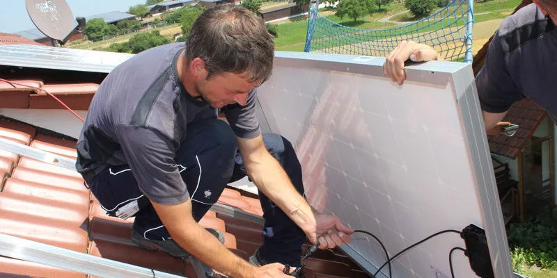 A SolarEdge optimiser being installed as part of a residential rooftop system