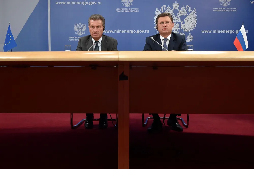 Price points: EU's Guenther Oettinger, left, urges interim solution as Russia's Alexander Novak, right, plans further talks
