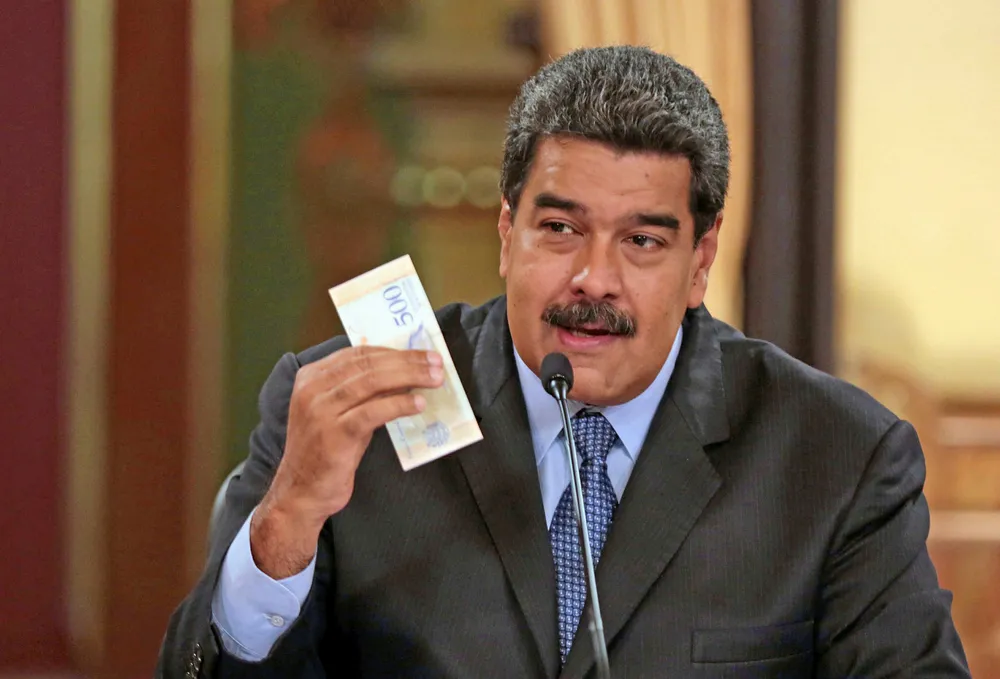 Currency affairs: Venezuelan President Nicolas Maduro presents fresh currency during a TV broadcast last week