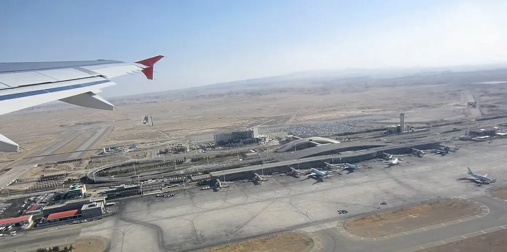 A plane takes off at Imam Khomeini International Airport, where a number of ships appeared to be lined up on Thursday. The ships could be spoofing their automatic identification system data.