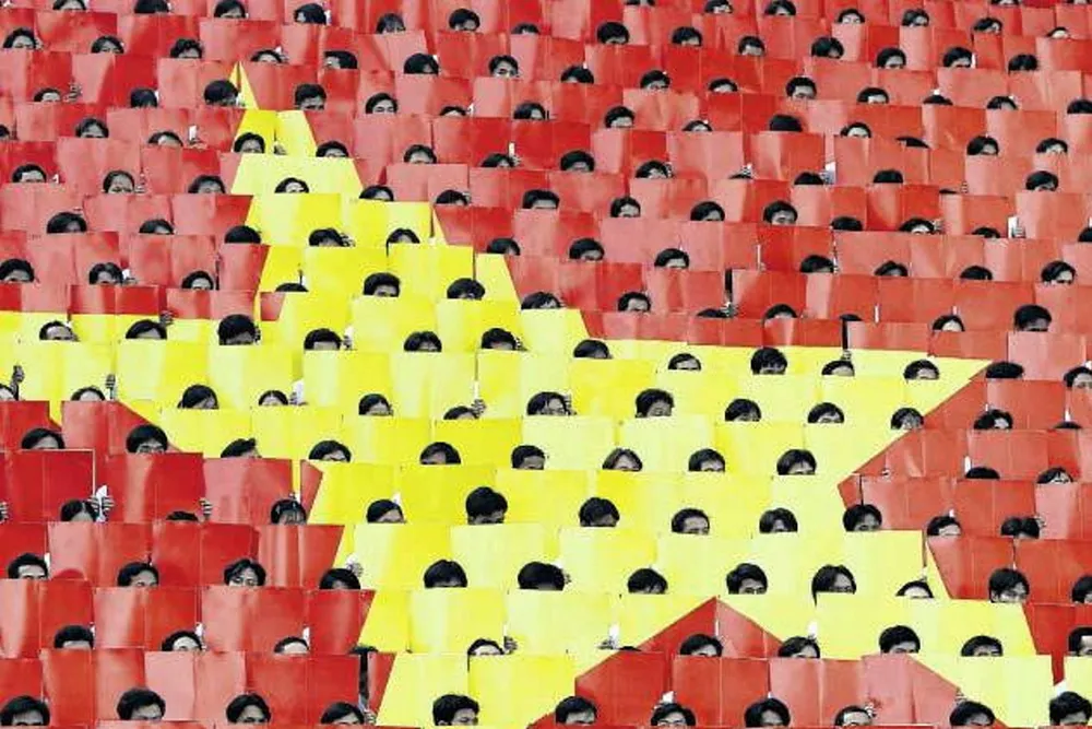Star power: students flip coloured placards in the sign of a Vietnamese flag in Ho Chi Minh City