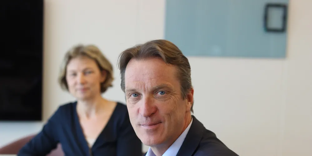 Jon Hindar, CEO of Cermaq, with the company's Communications Director Lise Bergan in the background.