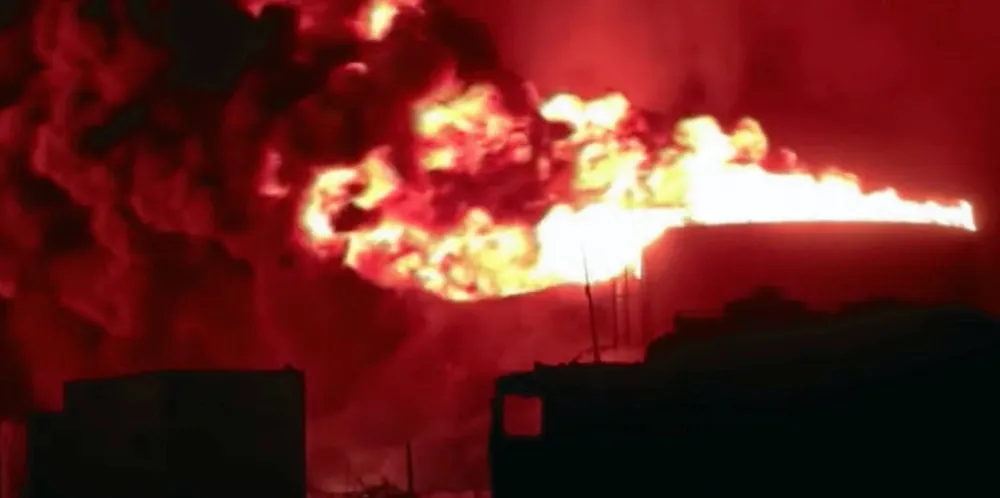 The port of Hodeidah in flames during earlier attacks.