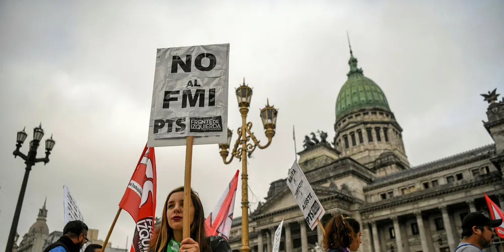 Members of leftist organisations demonstrate outside Argentina's National Congress against the government's negotiations with the IMF.