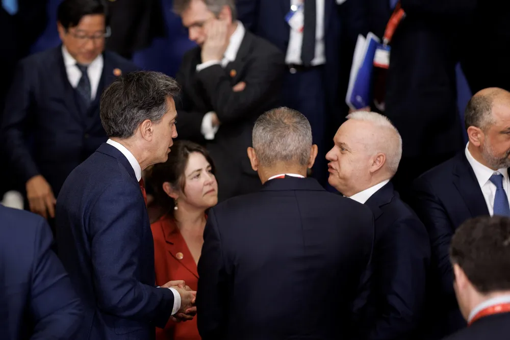 UK energy secretary Ed Miliband talks with Equinor CEO Anders Opedal at a recent energy security summit in London.