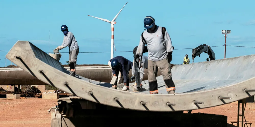 Workers at a wind farm in Rio Grande do Norte State, Brazil, part of a supply chain that has seen its prospects dip dramatically. Pic: YASUYOSHI CHIBA/AFP/Getty Images