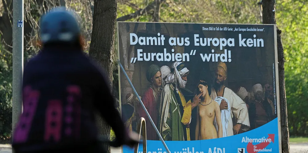 A billboard for the European elections by the right-wing Alternative for Germany (AfD) political party depicts part of the painting "The Slave Market" by Jean-Leon Gerome with the text: "So That Europe Doesn't Become "Eurabia!" and "Europeans vote AfD" on April 17, 2019 in Berlin, Germany. Political parties across Germany have launched their campaigns for European parliamentary elections that will be held at the end of May.