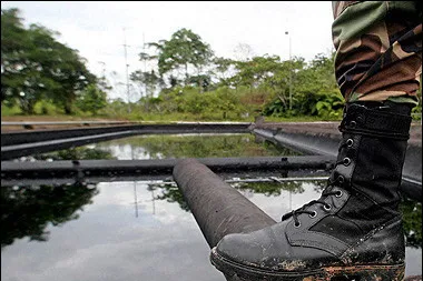 Controversial lands:a soldier guards an Amazonian oil well where similar protests have flared