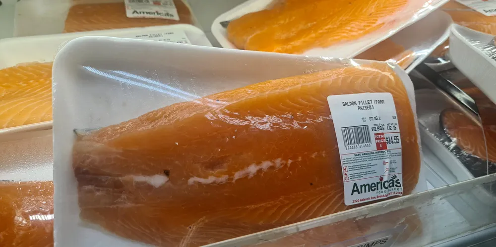Fresh fillet of farmed salmon for sale at America's Food Basket in Brooklyn, New York.