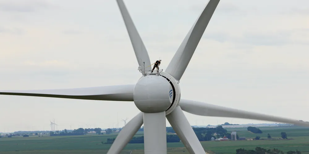 Technician atop Goldwind wind turbine in China