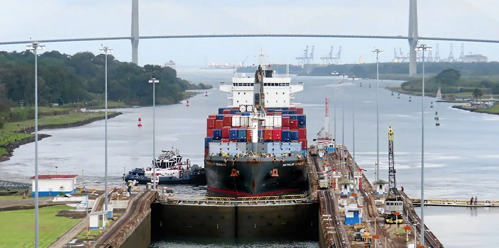 The 2,339-teu container ship Mathilde Schulte (built 2015) enters the Gatun Locks of the Panama Canal with the Puente Atlántico (2019) in the background.