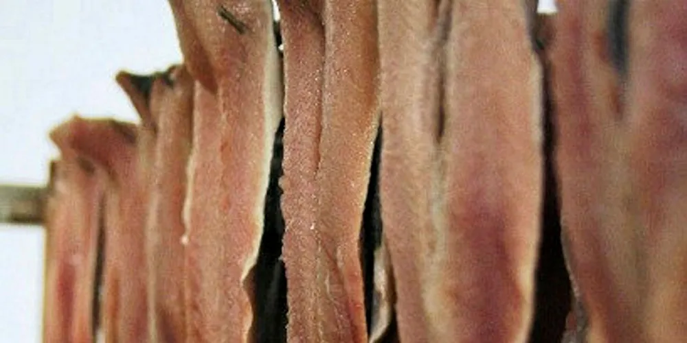 JC David is cited as one of the few remaining companies still using oak chips to infuse flavor into salmon, herring, mackerel and haddock in a process that takes up to six times longer than modern ovens.