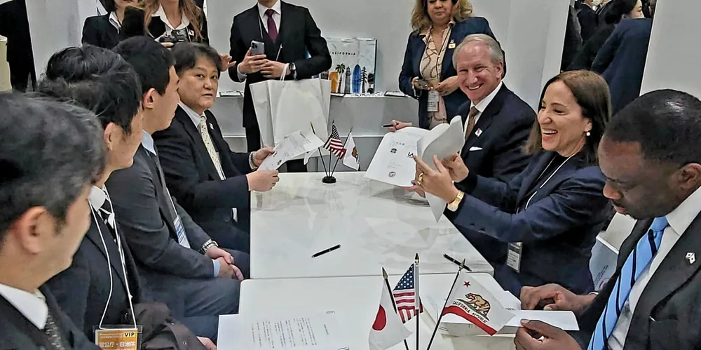 Officials from the Port of Tokyo, left, sign agreements with Port of Los Angeles and California delegation.