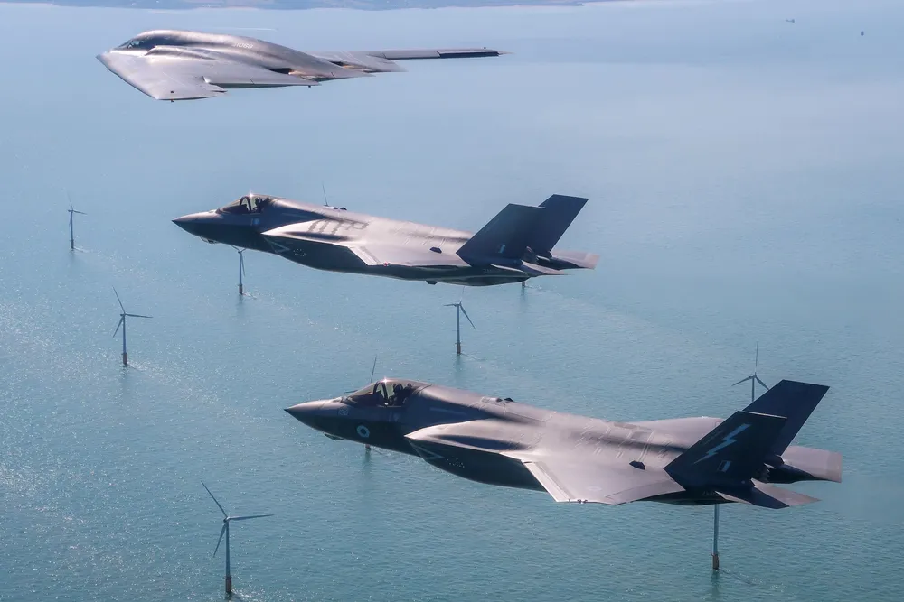 British and American jets fly above an offshore wind farm in the English Channel near Dover.