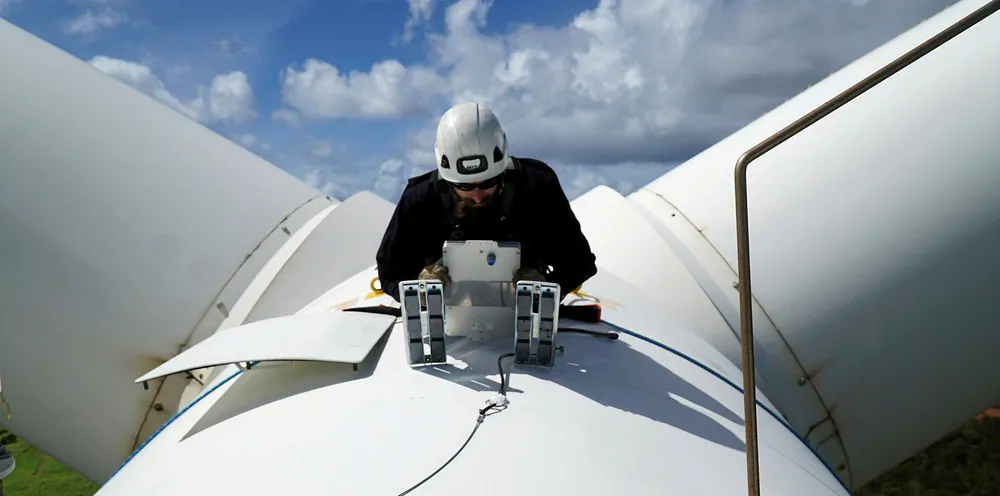 NRG Systems technician installing a bat deterrent system
