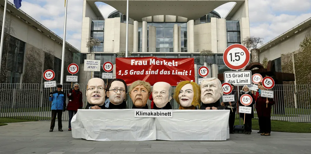 Activists of Campact wearing masks of Germany's cabinet. The VDMA wants federal action to help onshore wind.