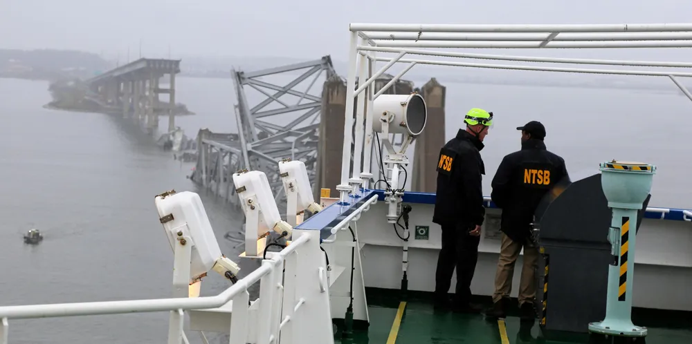 National Transportation Safety Board investigators stand on the Dali after it hit the Francis Scott Key Bridge. The casualty could lead to $3bn in total claims.