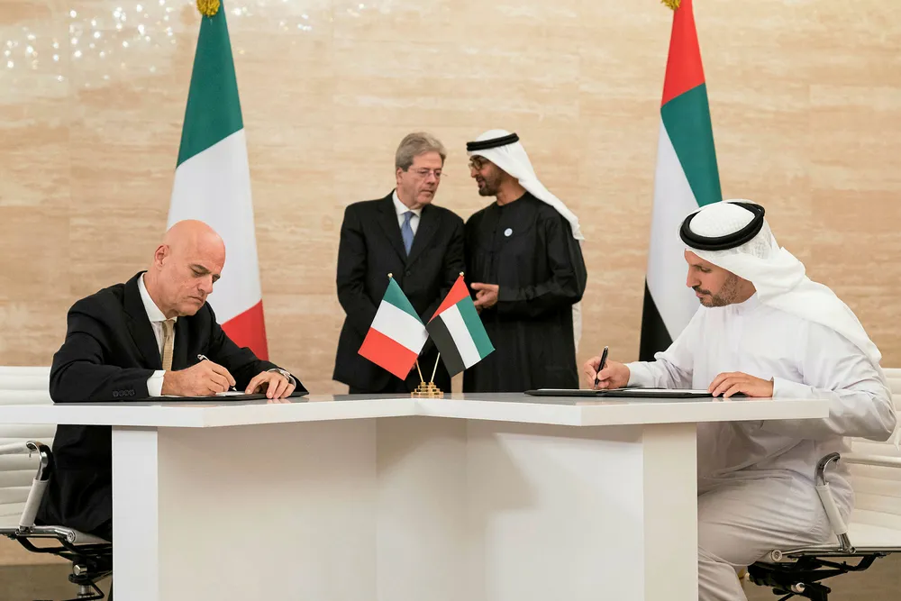 Signing: Eni chief executive Claudio Desalzi (L) signs documents with Mubadala chief Khaldoon Khalifa Al Mubarak (R) as Italian Prime Minister Paolo Gentiloni Silveri and Crown Prince of Abu Dhabi Mohamed bin Zayed Al Nahyan watch on