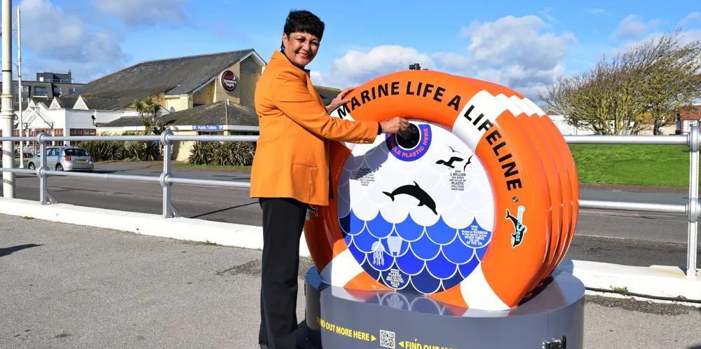 Former TradeWinds' columnist Fazilette Khan with one of her charity Green Seas Trust's recycling bins.