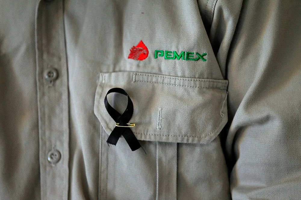 Rising toll: the number of people killed in a blast at Pemex's headquarters has risen to 37