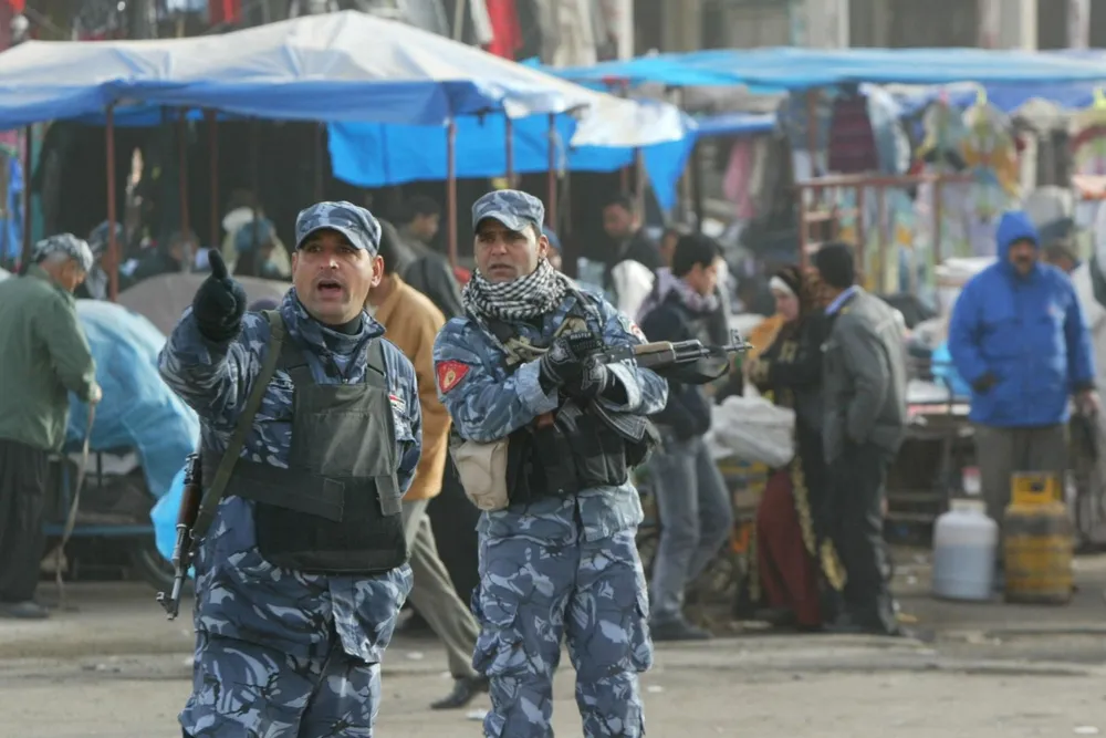 Security risks: Iraqi policemen on patrol in Kirkuk in northern Iraq's oil region