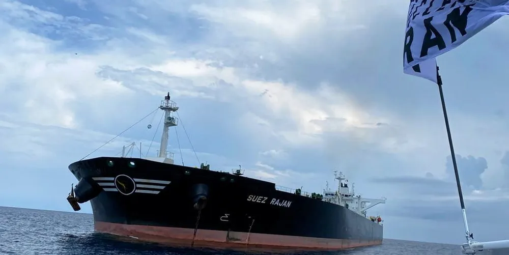 The United Against Nuclear Iran flag flies near the Suez Rajan. The ship spent months anchored off Texas after it was seized.