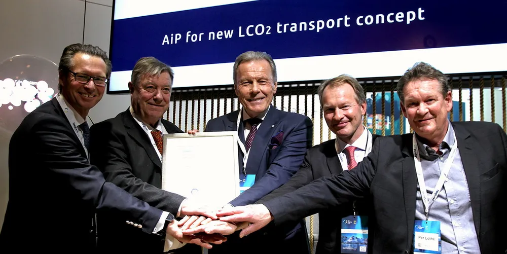 Knutsen NYK Carbon Carriers wins approval in principle for its design. (From left) Knut Orbeck-Nilssen, DNV Maritime CEO, presents the AiP to Trygve Seglem, owner of Knutsen and vice chair of KNCC; Svein Steimler, CEO of NYK Europe, and chair of KNCC; Anders Lepsoe, CEO of KNCC; and Per Lothe, technical advisor to KNCC.