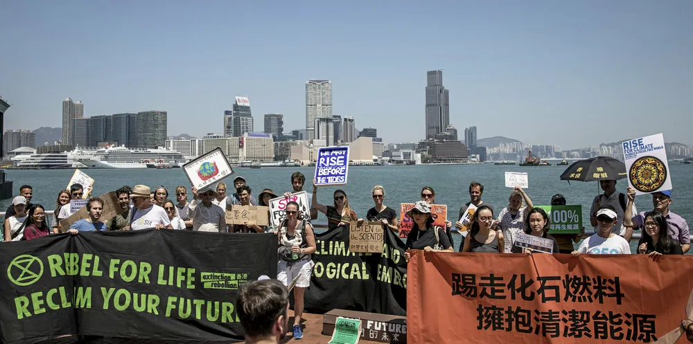 Protesters hold signs and chant slogans during the Hong Kong Climate Strike rally on September 20, 2019 in Hong Kong, China.