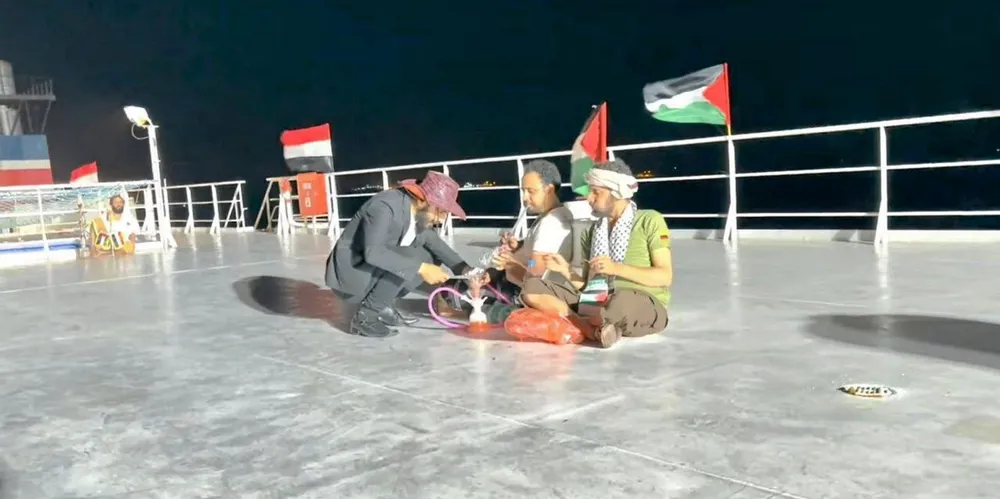 Houthi Galaxy Leader. Houthi guards smoke hookah on hijacked Galaxy Leader.