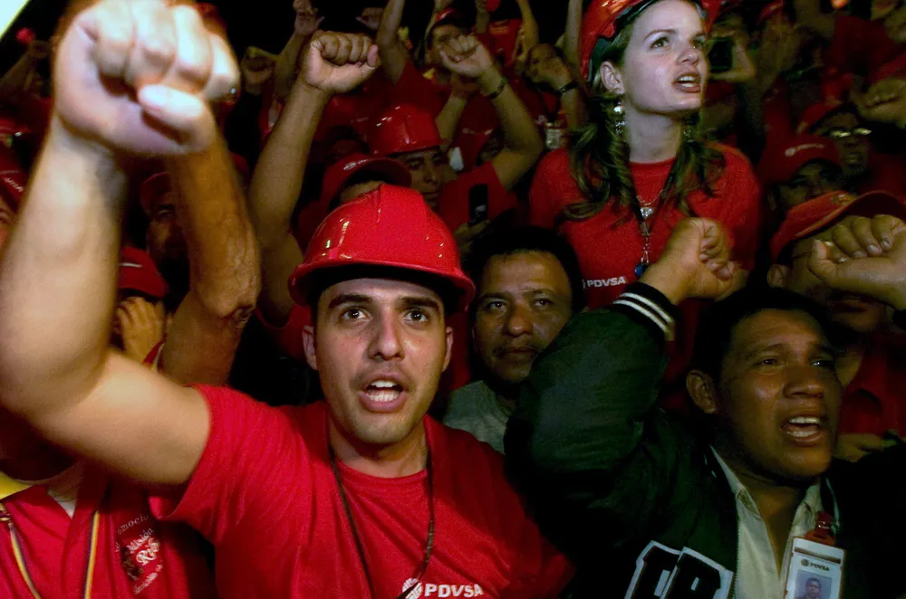 Seeing red: PDVSA workers celebrate the takeover of projects in Venezuela's Orinoco heavy oil belt earlier this year