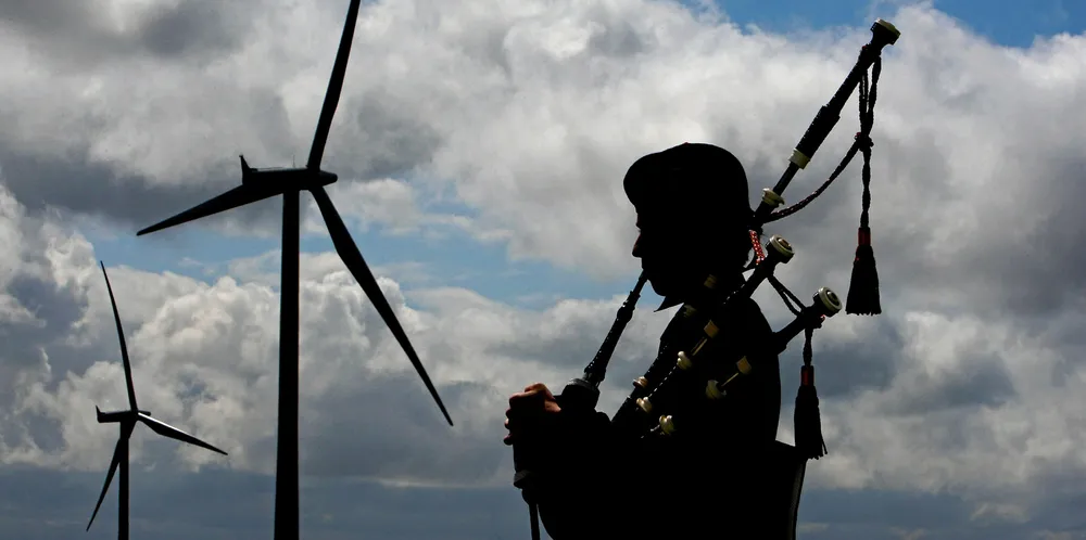 Piper David Wilton plays at the switch on of Whitelee wind farm, currently the UK's largest.