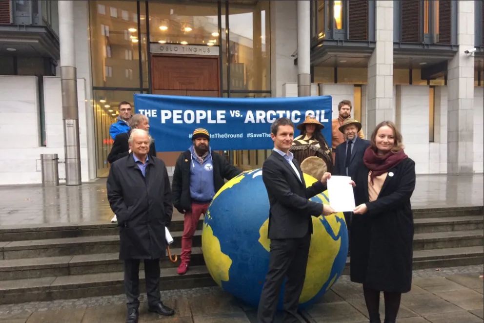 Legal challenge: (in front) Greenpeace Norway leader Truls Gullowsen and the group's lawyer Michelle Jonker-Argueta with the lawsuit
