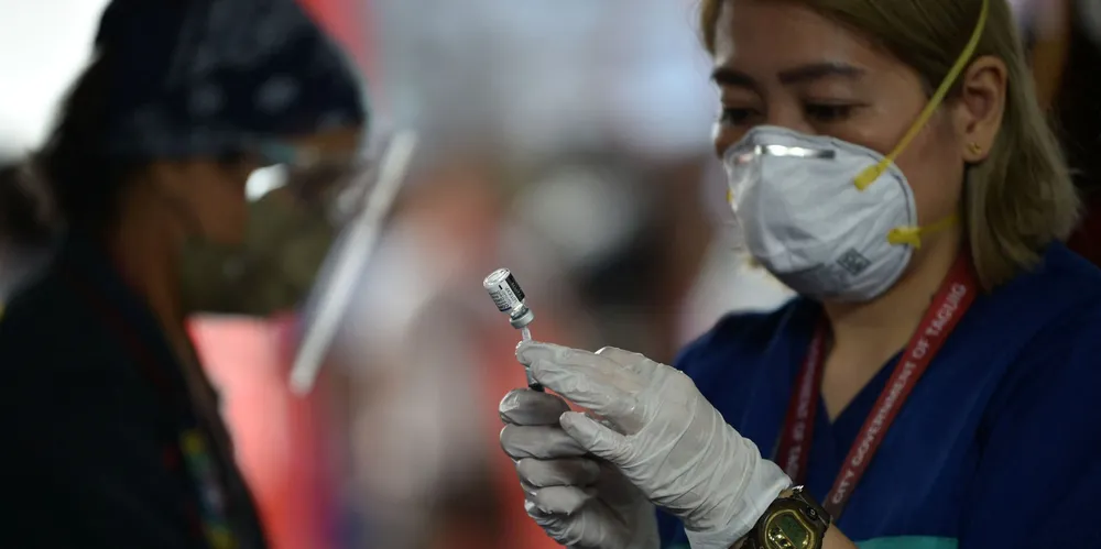 A medical worker prepares a Covid-19 vaccine during an inoculation drive at a school gym in Taguig City, a suburb of Manila, on Monday. Vaccination rates in the Philippines, a major supplier of seafarer labour, are lagging behind the global average.