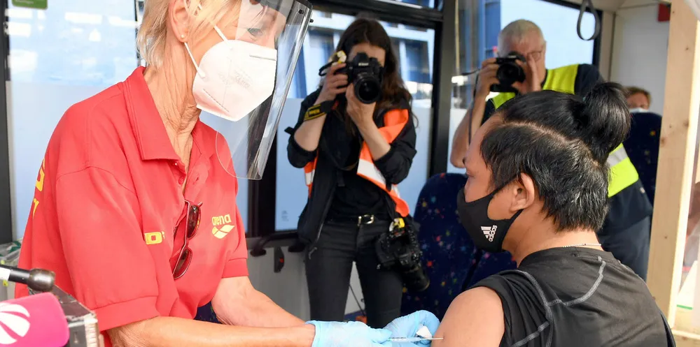 A seafarer receives a Johnson & Johnson jab at the port of Bremen. The port is beginning to offer vaccines to seafarers from all over the world.