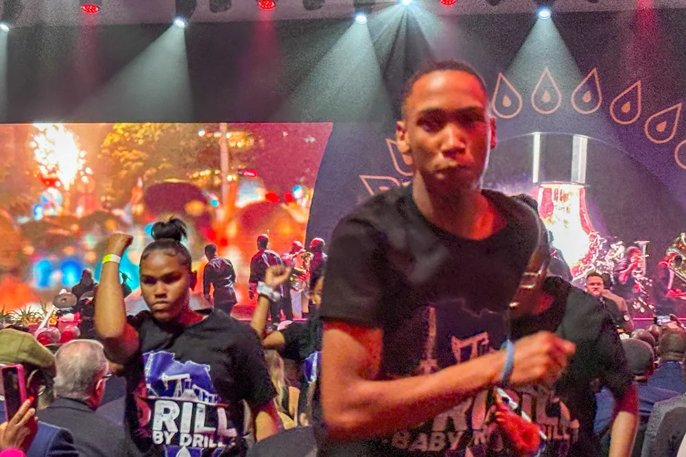 African Energy Week performers wear shirts emblazoned with "DRILL BABY DRILL" during the opening ceremony in Cape Town, South Africa.