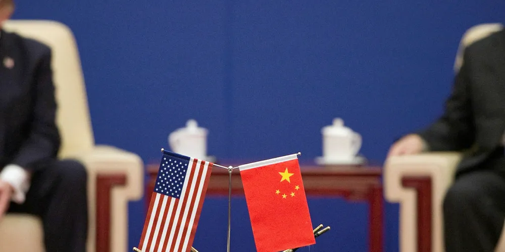 US President Donald Trump (L) and China's President Xi Jinping attend a business leaders event inside the Great Hall of the People in Beijing on November 9, 2017.