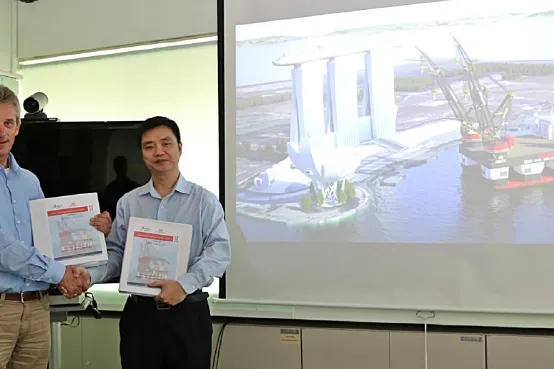 Sipke Schuurmans, Project Director of Heerema Offshore Services and Mr William Gu, Sembcorp Marine Head of Rigs & Floaters, finalise the huge semisub EPC deal