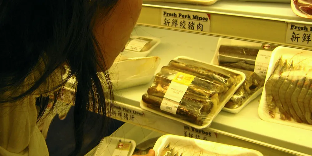 Checking out the shrimp at a Chinese supermarket.