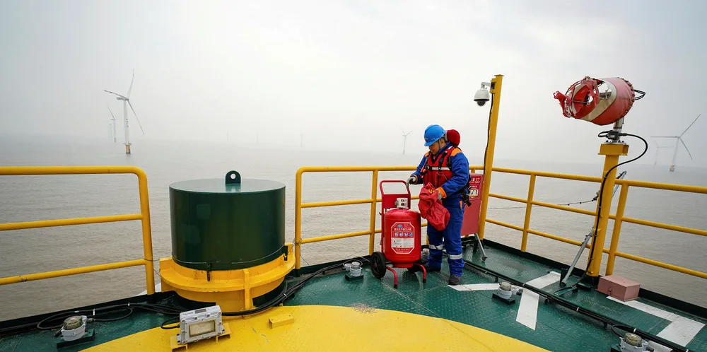 An engineer checks equipment at Rudong offshore wind farm of China General Nuclear Power Corporation (CGN) in Rudong County of Nantong City, east China's Jiangsu Province.