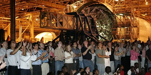 Hundreds of employees gather to watch the successful launch of the space shuttle Discovery at the Michoud Assembly Facility on Tuesday, July 26, 2005