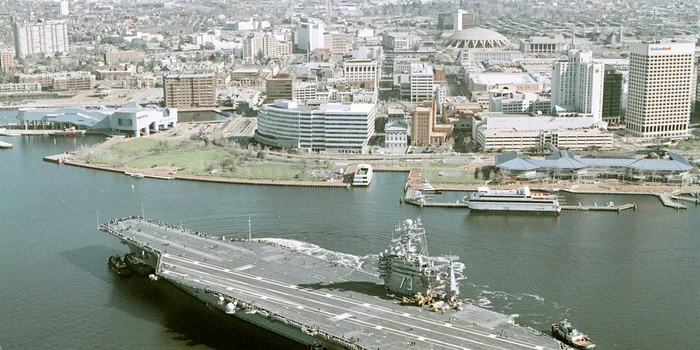 A US aircraft carrier sails out of Virginia's Hampton Roads, among the largest natural harbours in the world