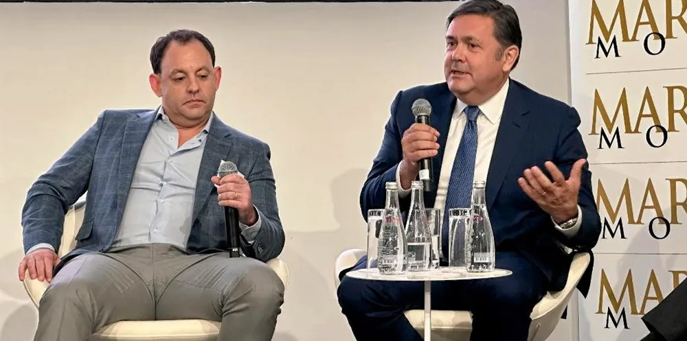 Ridgebury Tankers CFO Hew Crooks (right) opens fire on the Maxim Group and Top Ships, as Maxim investment banker Larry Glassberg listens.