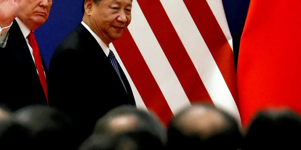 U.S. President Donald Trump and China's President Xi Jinping meet business leaders at the Great Hall of the People in Beijing, China.